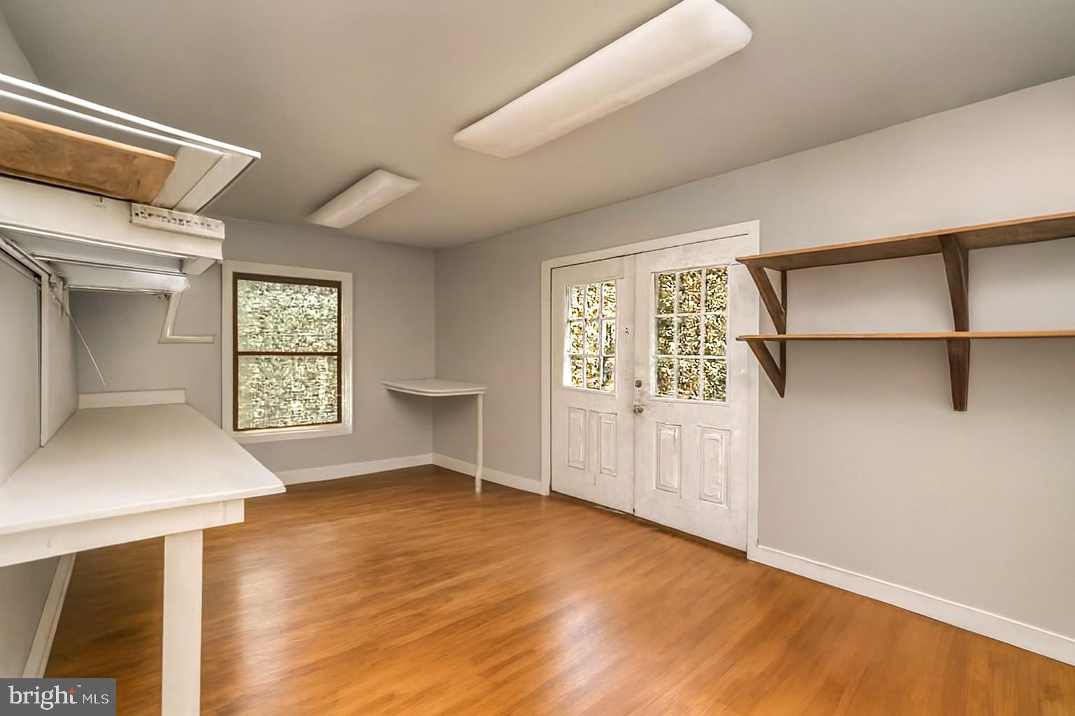 6709 Marye Road Spotsylvania, VA 22551 - Photo 67 of 73 a view of an empty room with a window and wooden floor