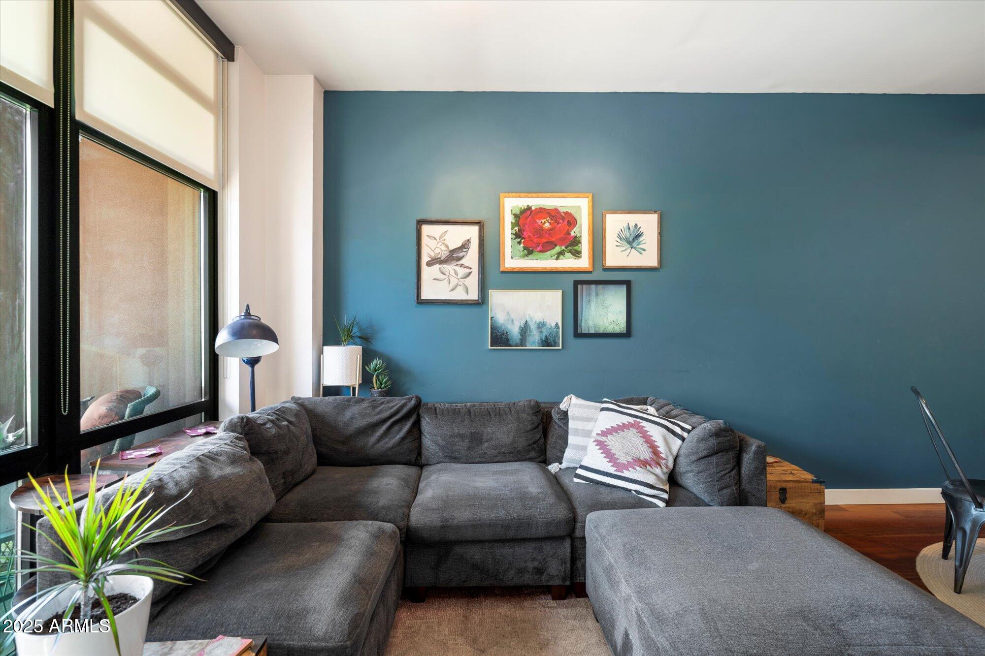 310 South 4th Street, Unit 908 Phoenix, AZ 85004 - Photo 12 of 44 a living room with furniture cabinets and a flat screen tv