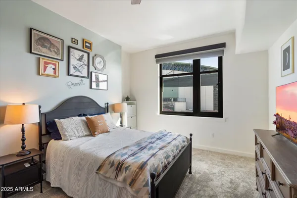 a bedroom with a bed and furniture