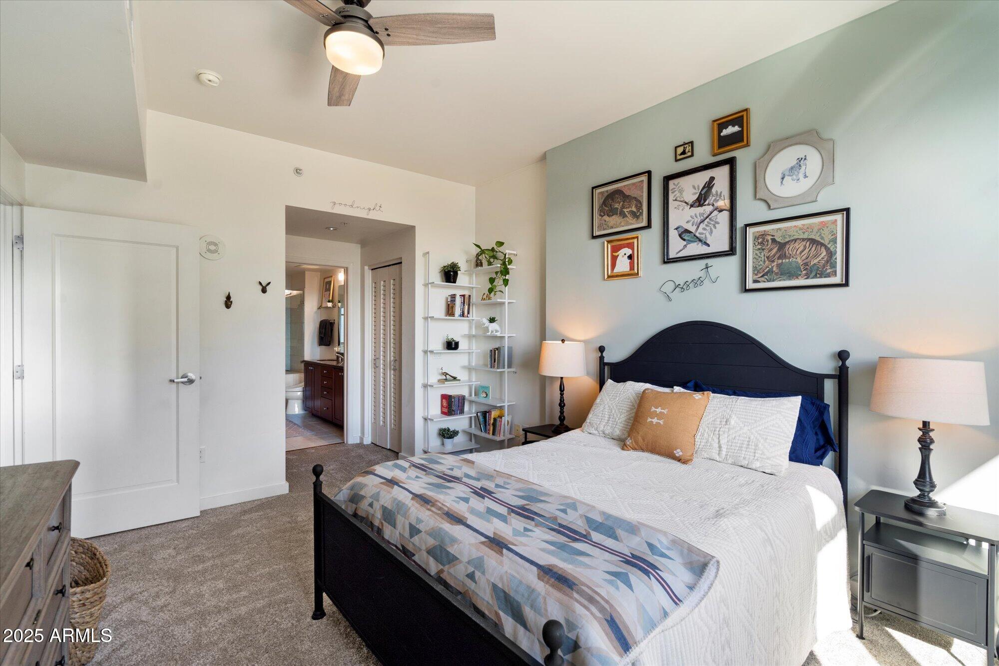 310 South 4th Street, Unit 908 Phoenix, AZ 85004 - Photo 19 of 44 a bedroom with a bed and painting on the wall