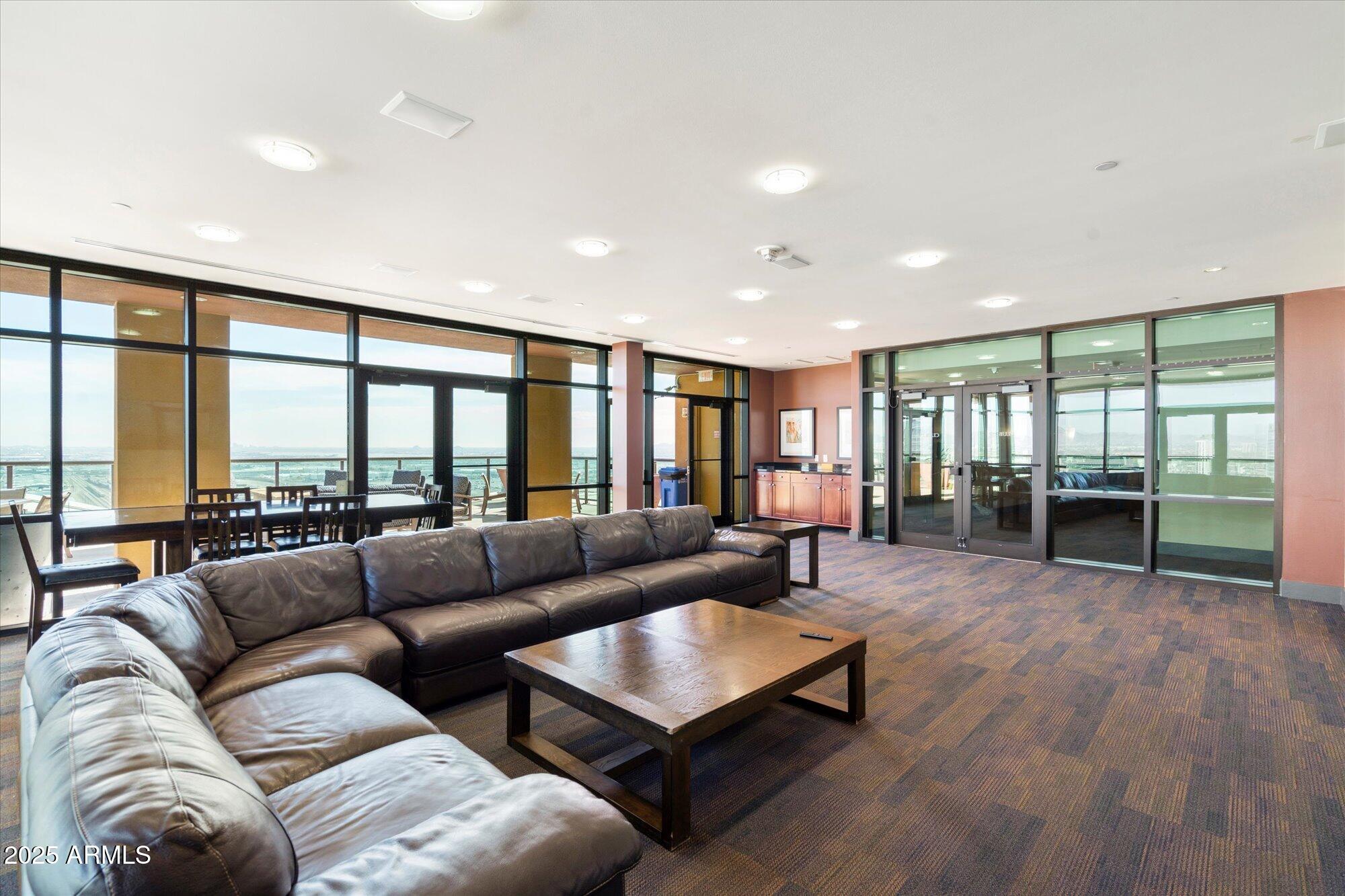 310 South 4th Street, Unit 908 Phoenix, AZ 85004 - Photo 29 of 44 a living room with furniture and a large window