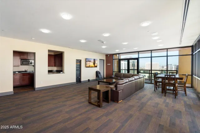 a living room with furniture and a large window
