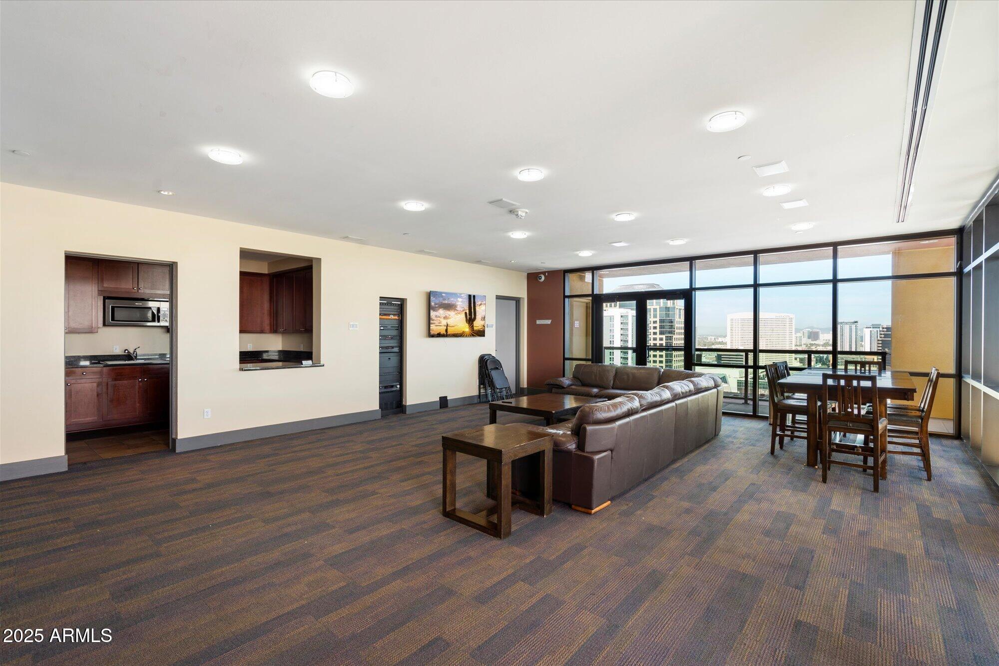 310 South 4th Street, Unit 908 Phoenix, AZ 85004 - Photo 30 of 44 a living room with furniture and a wooden floor