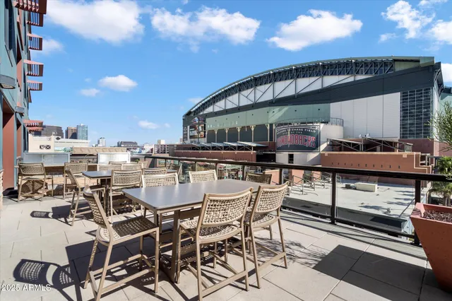 a view of a swimming pool with outdoor seating