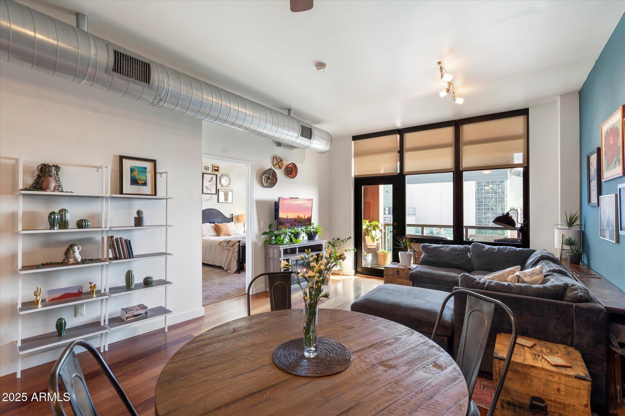 310 South 4th Street, Unit 908 Phoenix, AZ 85004 - Photo 7 of 44 a living room with furniture and a large window