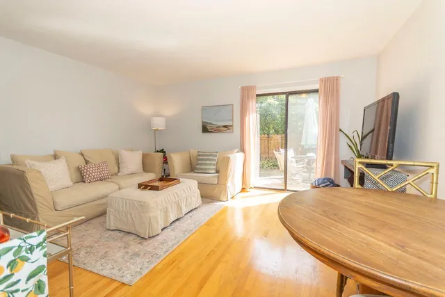 a living room with furniture and a table