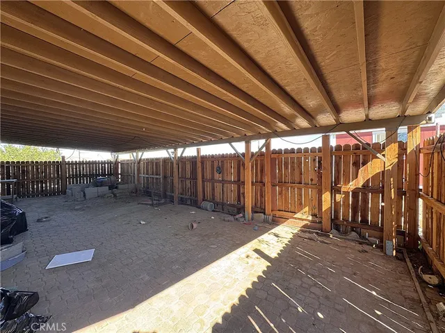 a view of a backyard with table and chairs