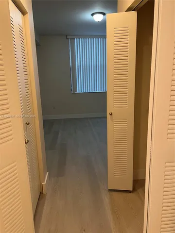 a view of a room with windows