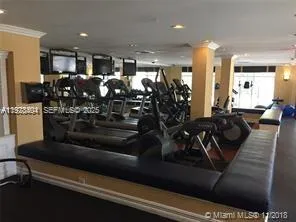 a kitchen with stainless steel appliances granite countertop a refrigerator a stove and a sink