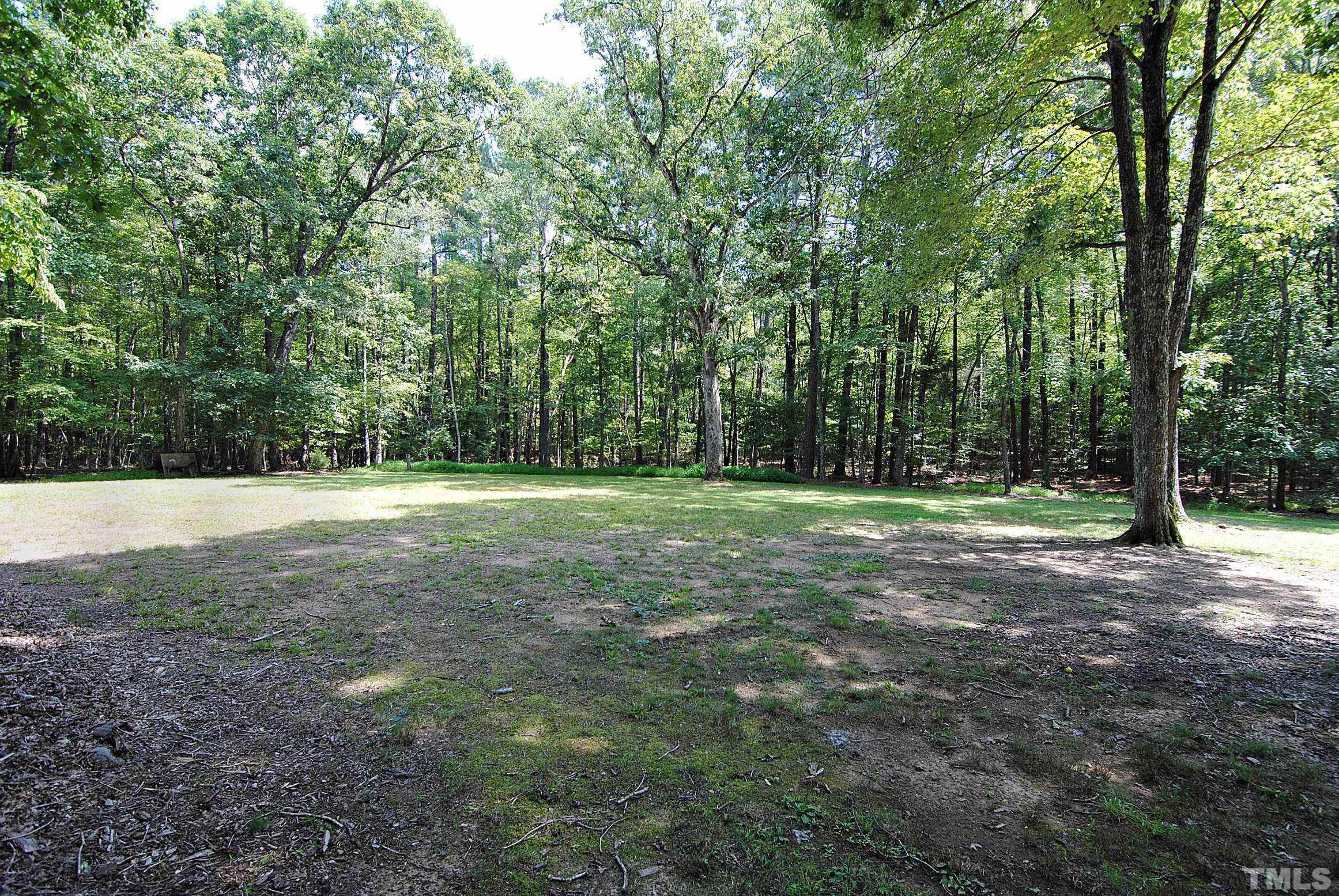 7106 Matthews Road Durham, NC 27712 - Photo 29 of 30 a view of outdoor space with trees all around