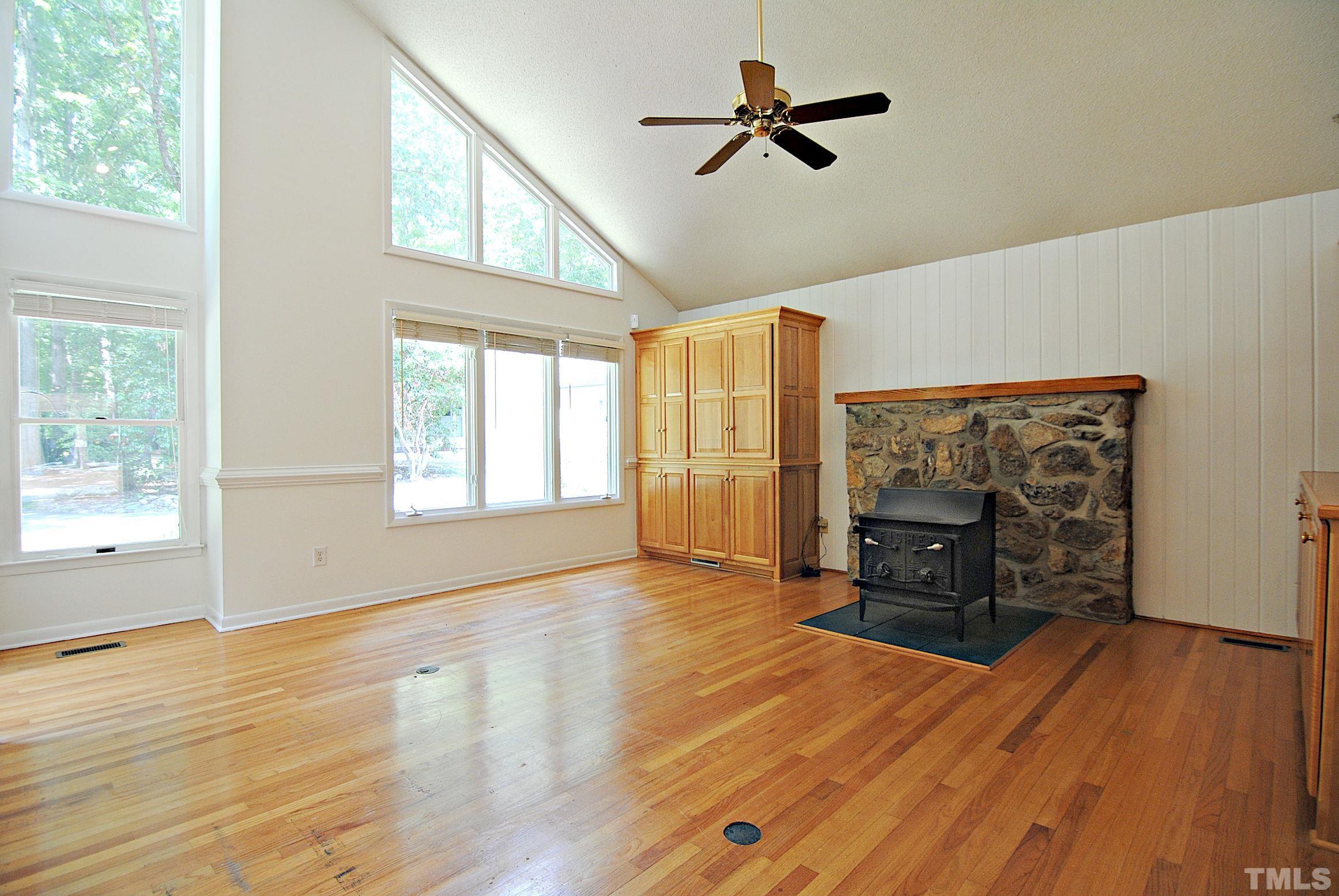 7106 Matthews Road Durham, NC 27712 - Photo 5 of 30 a view of empty room with wooden floor and fan