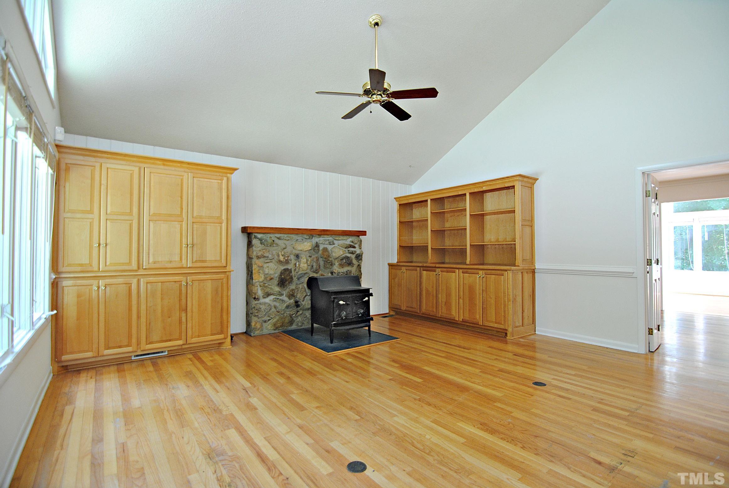 7106 Matthews Road Durham, NC 27712 - Photo 6 of 30 a view of empty room with wooden floor and window