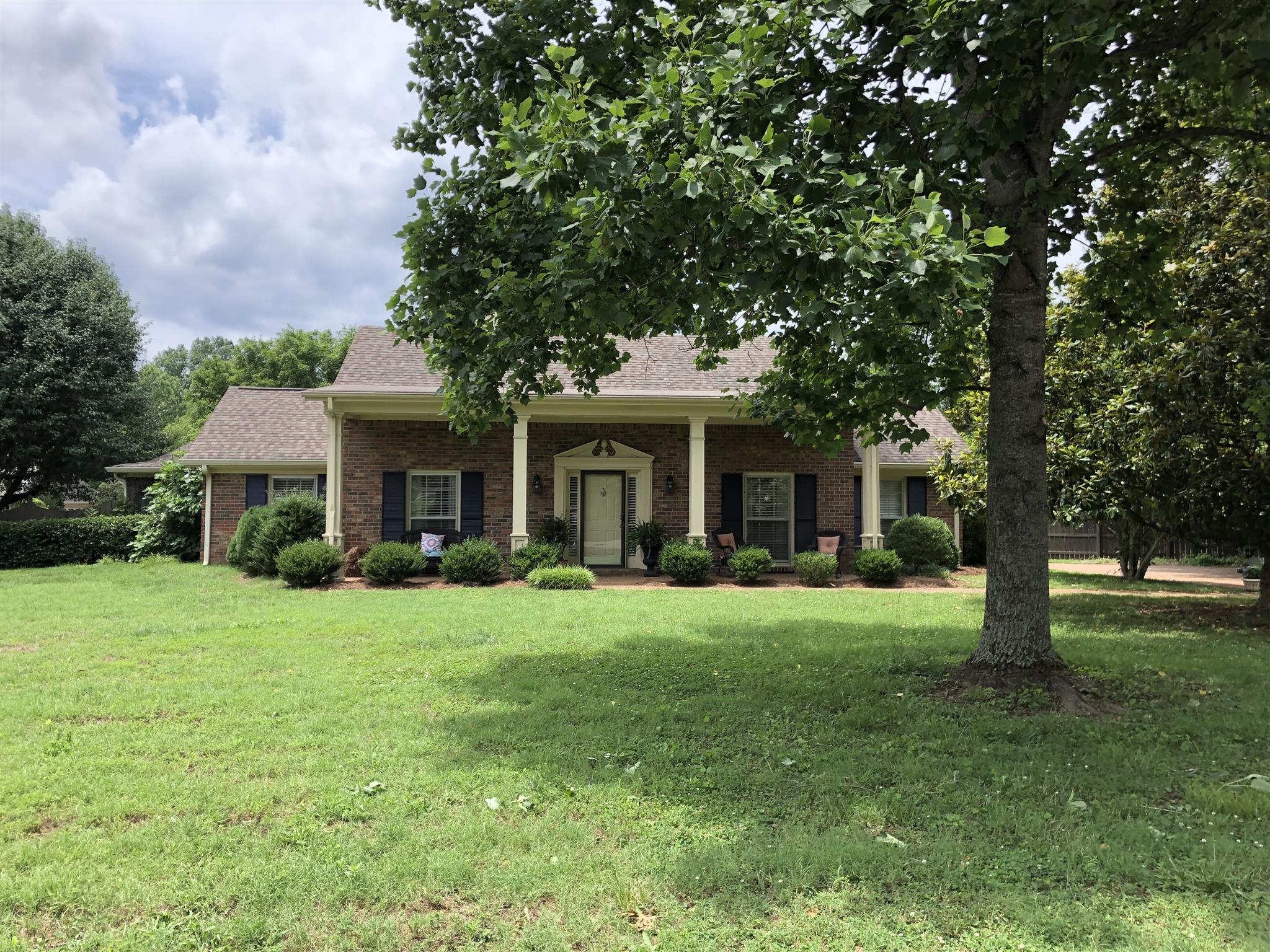 1501 Blue Springs Road Franklin, TN 37069 - Photo 1 of 30 a front view of a house with a garden