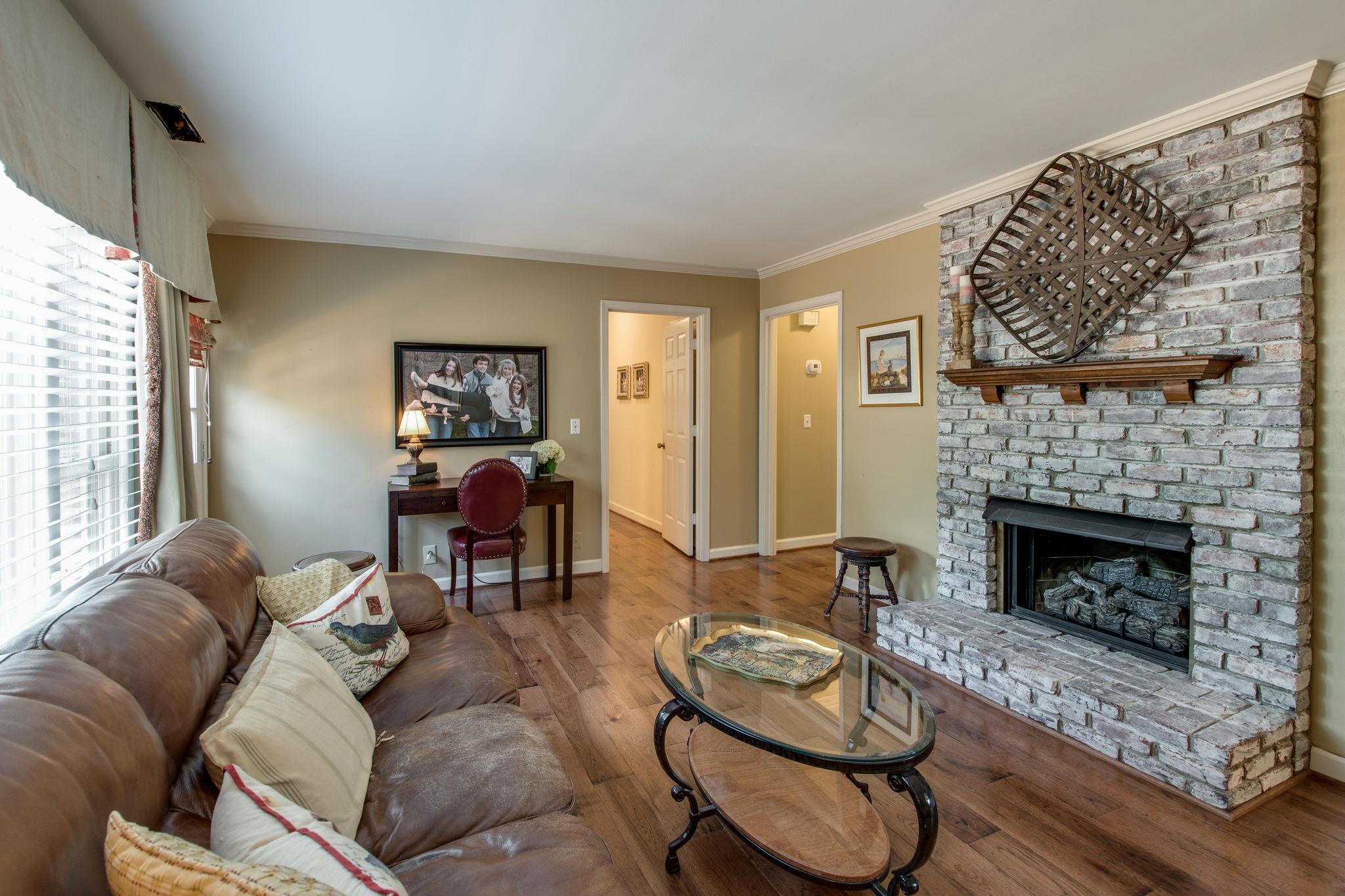 1501 Blue Springs Road Franklin, TN 37069 - Photo 15 of 30 a living room with furniture and a fireplace