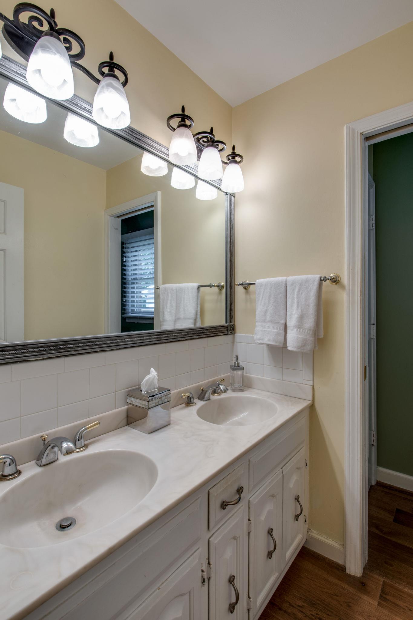 1501 Blue Springs Road Franklin, TN 37069 - Photo 20 of 30 a bathroom with a double vanity sink and a mirror