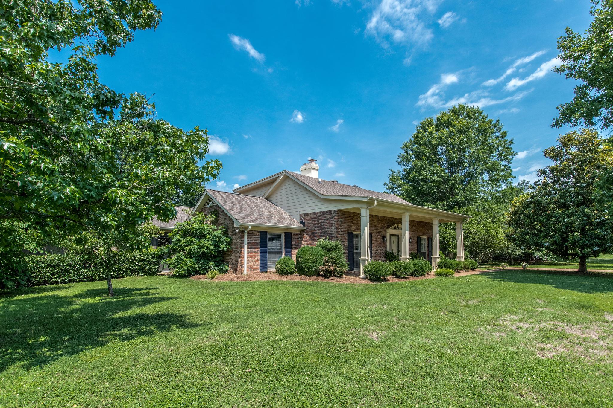 1501 Blue Springs Road Franklin, TN 37069 - Photo 3 of 30 a front view of a house with a garden