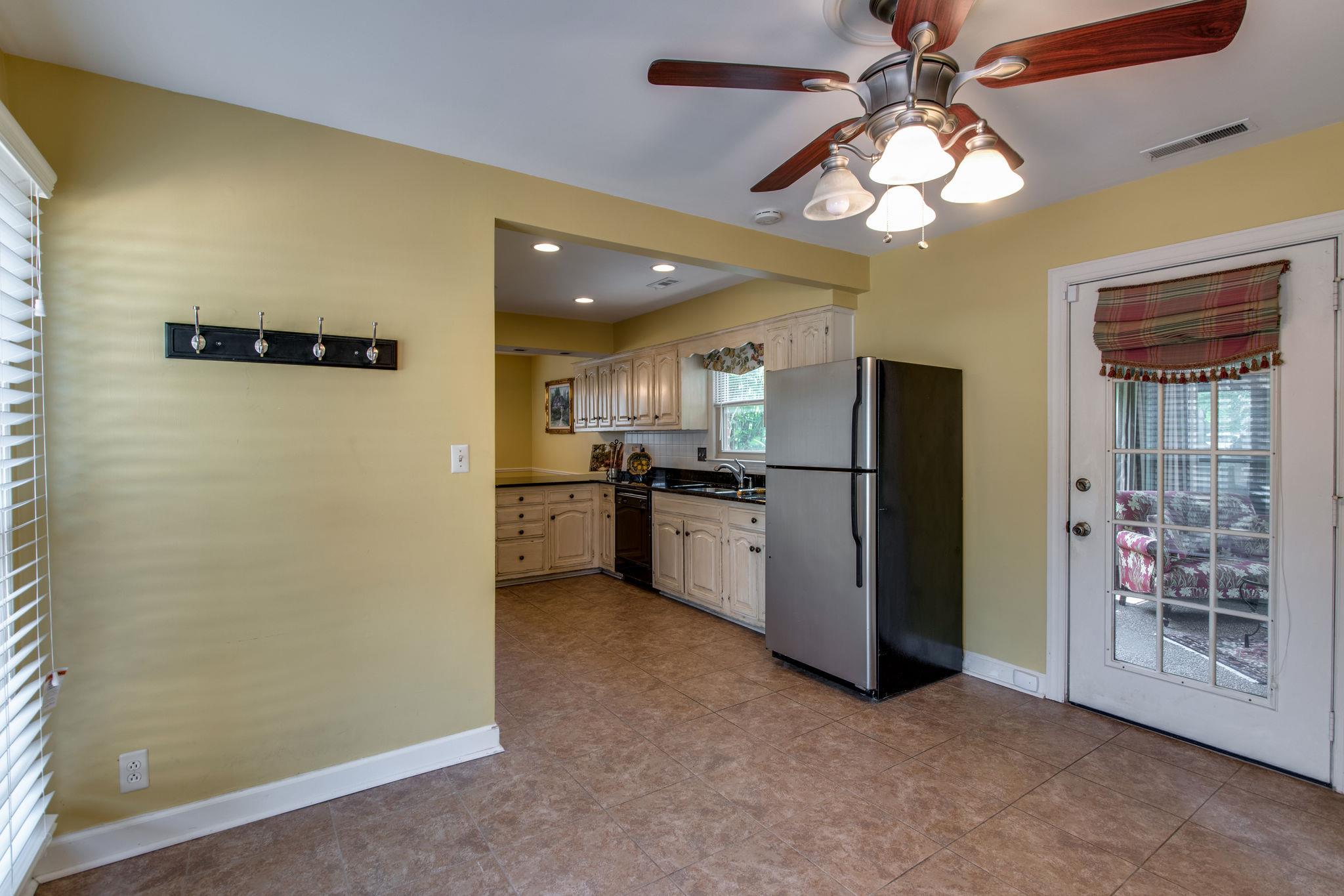 1501 Blue Springs Road Franklin, TN 37069 - Photo 8 of 30 a view of a kitchen with a refrigerator a microwave and a ceiling fan