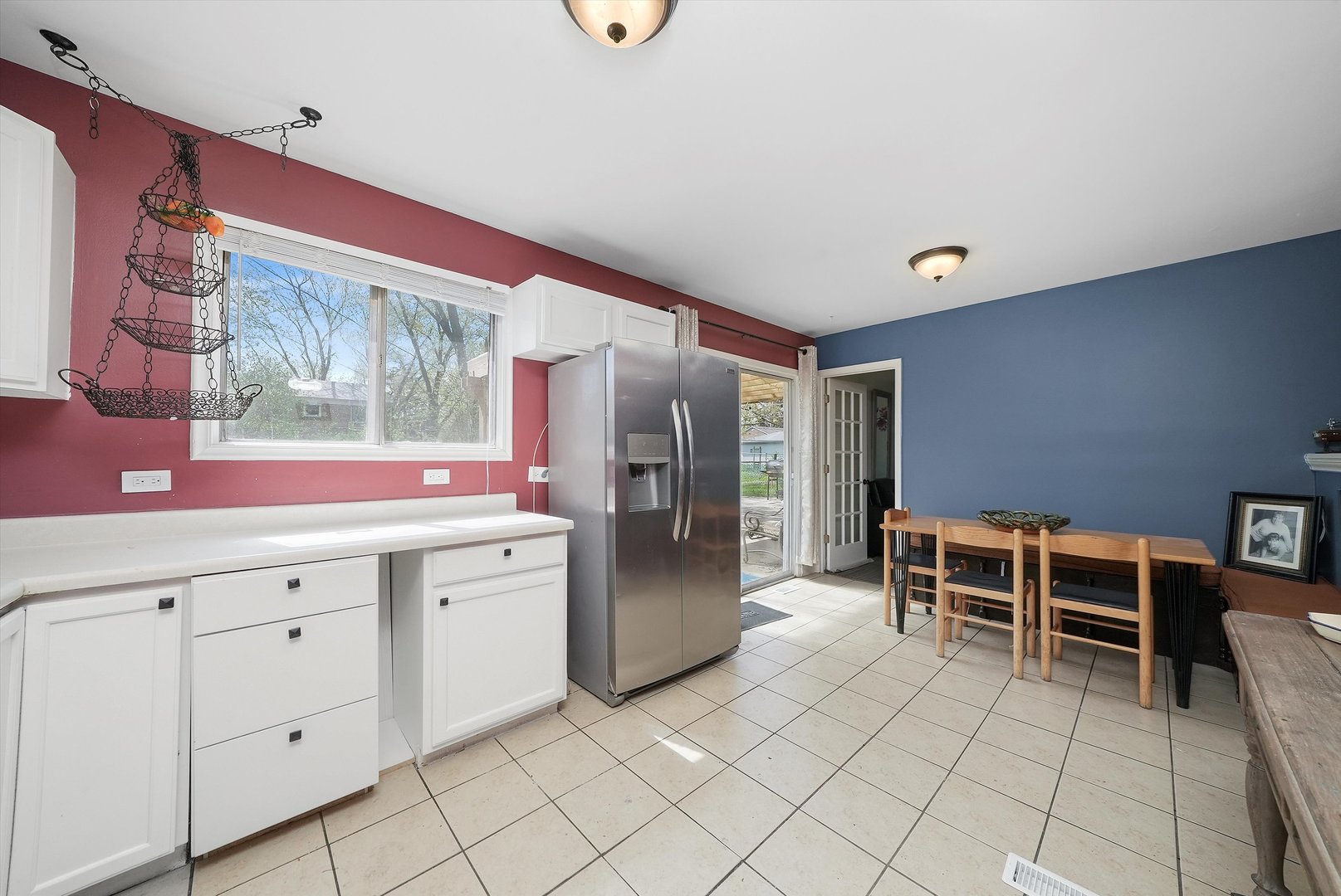 176 Oxford Road Bolingbrook, IL 60440 - Photo 13 of 43 a kitchen with white cabinets and stainless steel appliances
