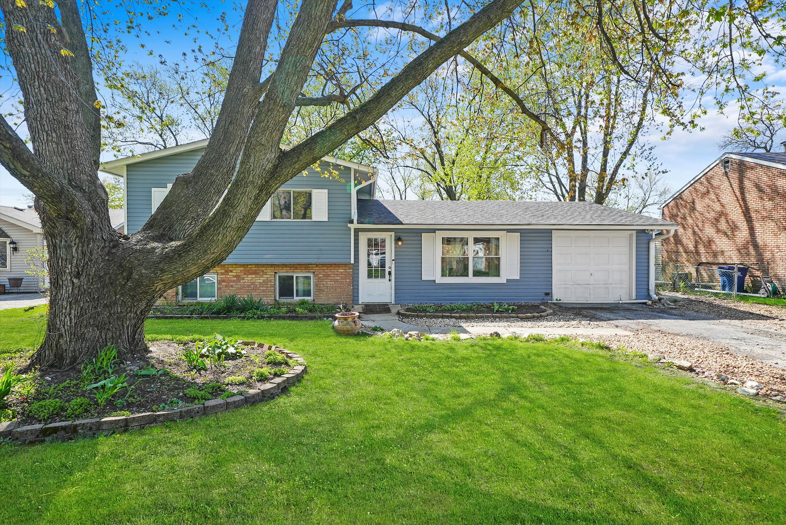 176 Oxford Road Bolingbrook, IL 60440 - Photo 3 of 43 a view of a house with a yard