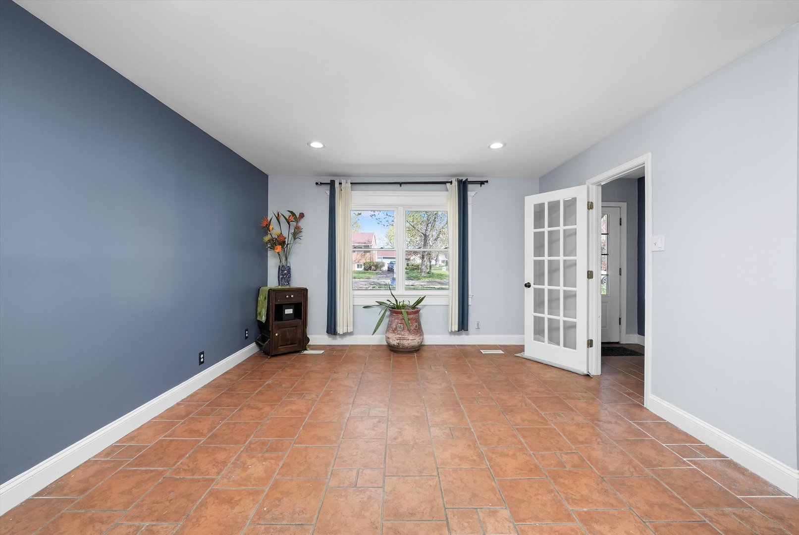 176 Oxford Road Bolingbrook, IL 60440 - Photo 5 of 43 a view of an empty room with a fireplace and a window