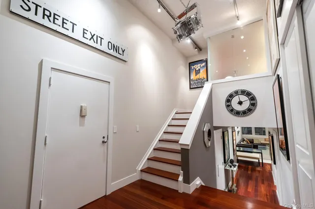 a living room with furniture and a lamp