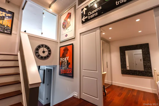 a view of an entryway with wooden floor