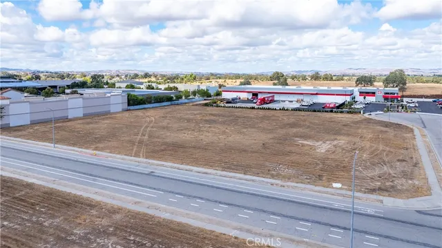swimming pool view with buildings and cars