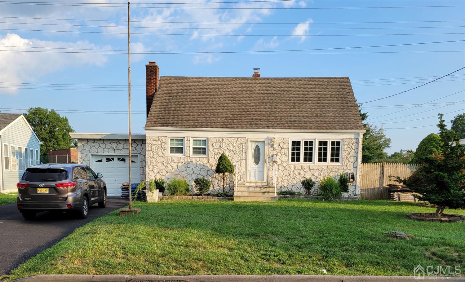 27 Longfield Road New Brunswick, NJ 08901 - Photo 1 of 19 a house view with a garden space