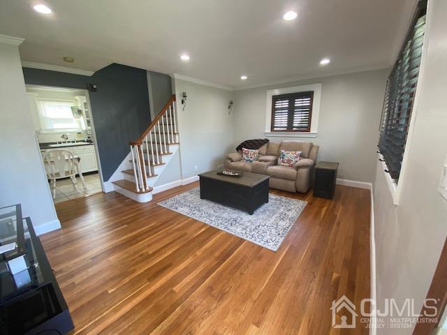 27 Longfield Road New Brunswick, NJ 08901 - Photo 4 of 19 a living room with furniture and a wooden floor