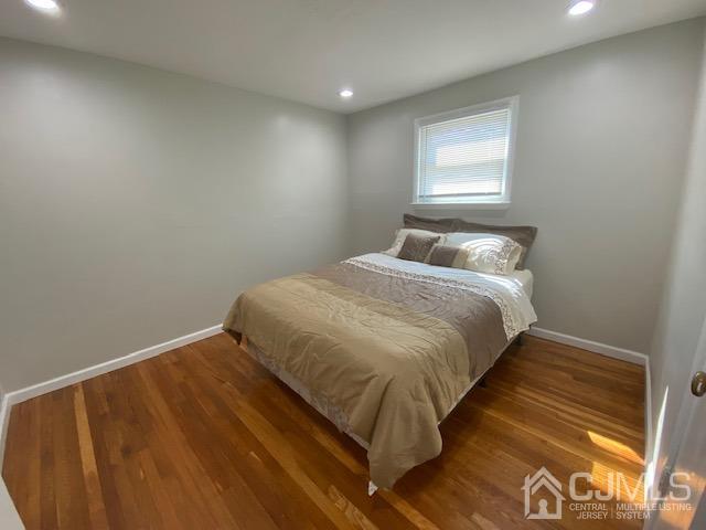27 Longfield Road New Brunswick, NJ 08901 - Photo 8 of 19 a bedroom with a bed and a window