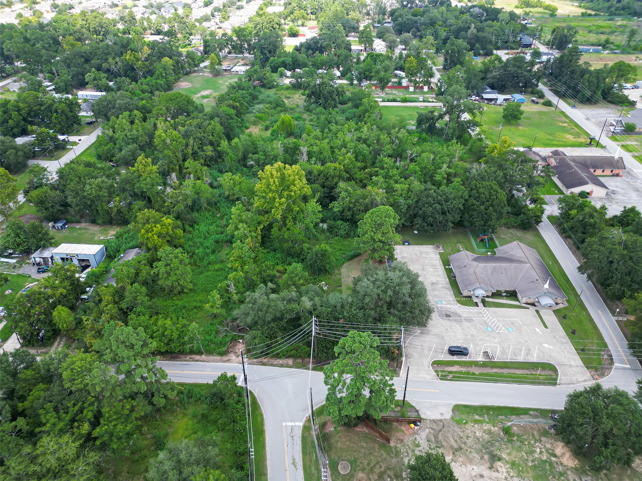 430 Booker Road Spring, TX 77373 - Photo 2 of 16 an aerial view of a house with a yard and lake view