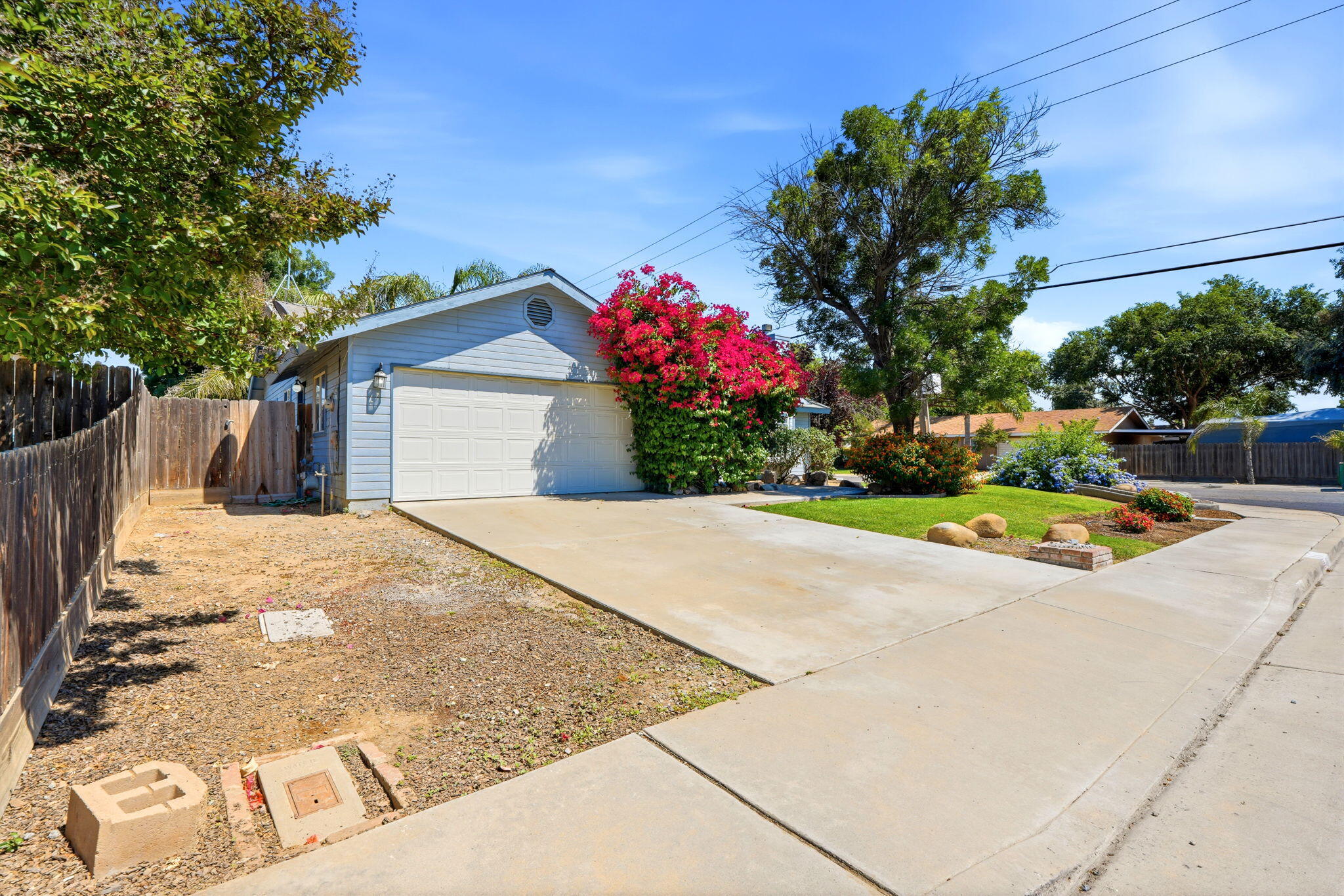 481 Katelyn Court Exeter, CA 93221 - Photo 3 of 33 a view of a house with a yard and garage