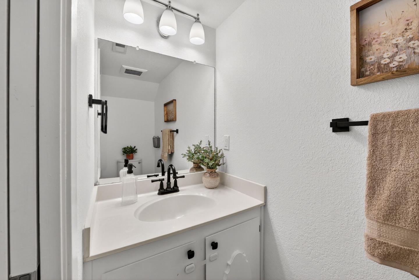 3513 Ivalynn Circle San Jose, CA 95132 - Photo 12 of 46 a bathroom with a sink and a mirror