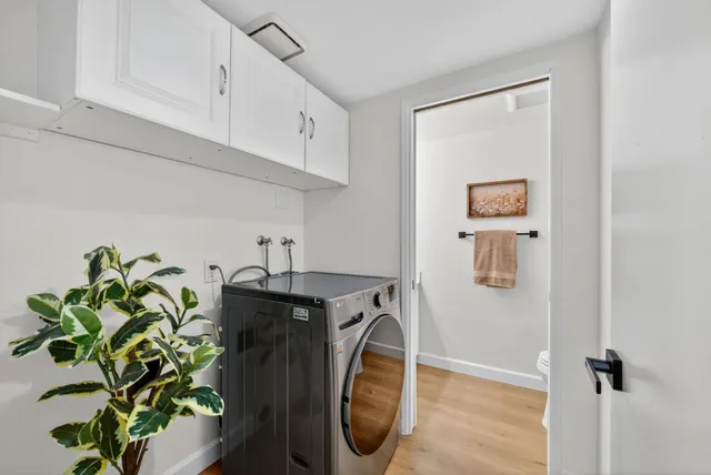a utility room with painting on the wall