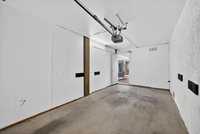 an aerial view of a house with a garden