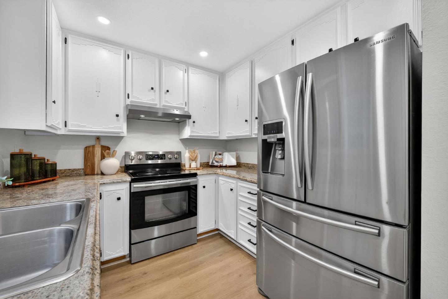 3513 Ivalynn Circle San Jose, CA 95132 - Photo 8 of 46 a kitchen with stainless steel appliances a refrigerator stove and sink