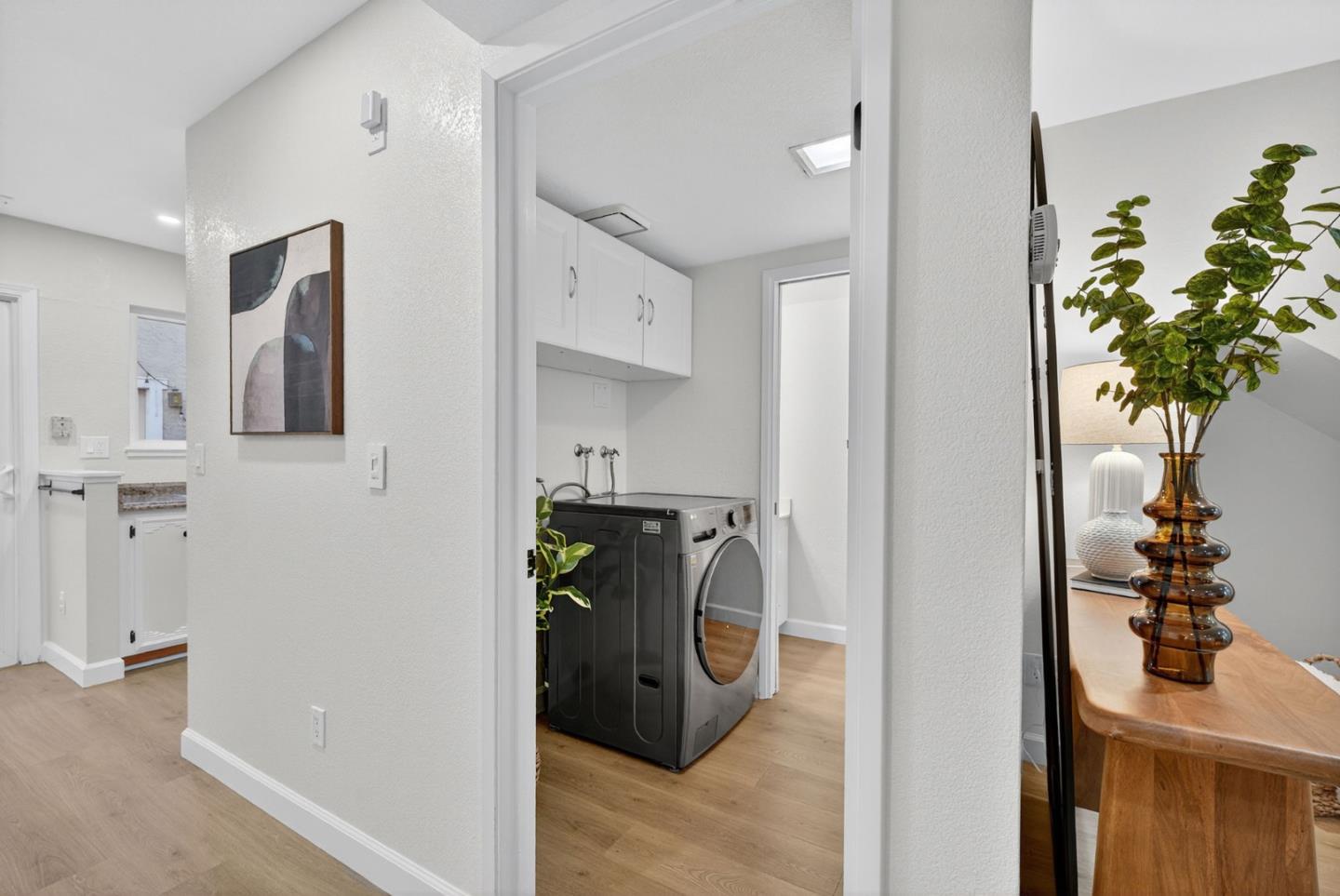 3513 Ivalynn Circle San Jose, CA 95132 - Photo 10 of 46 a view of a hallway with dining room and wooden floor
