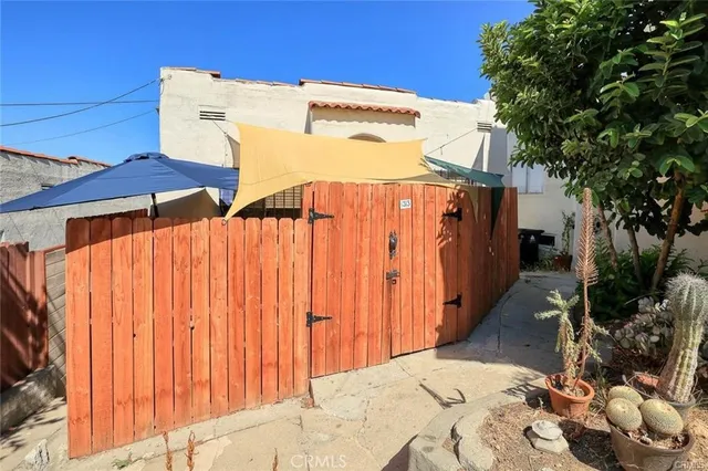 a potted plant sitting in front of a house