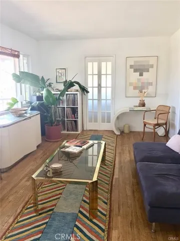 a spacious bedroom with a bed and a window