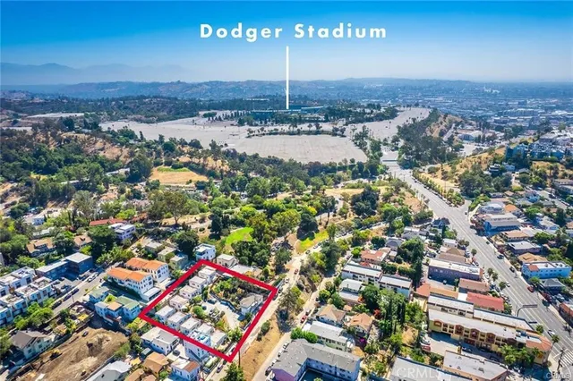 an aerial view of residential houses with outdoor space