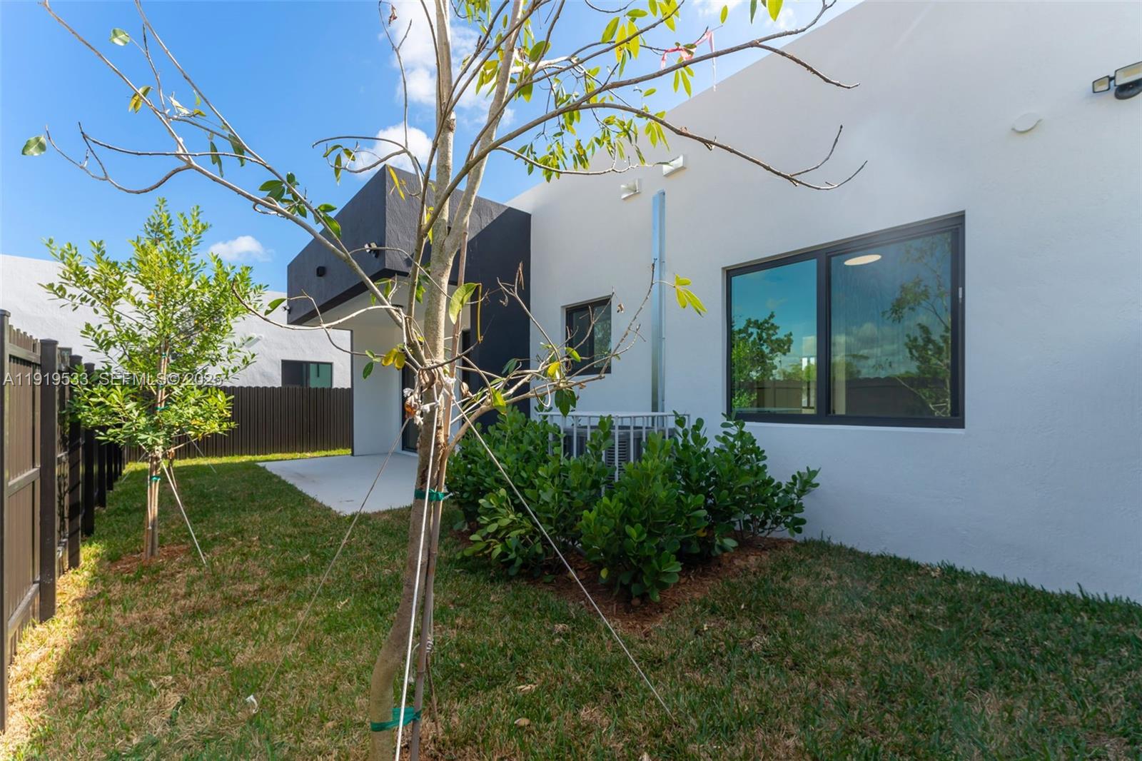 21911 Southwest 124th Avenue Miami, FL 33183 - Photo 22 of 24 a house view with a garden space
