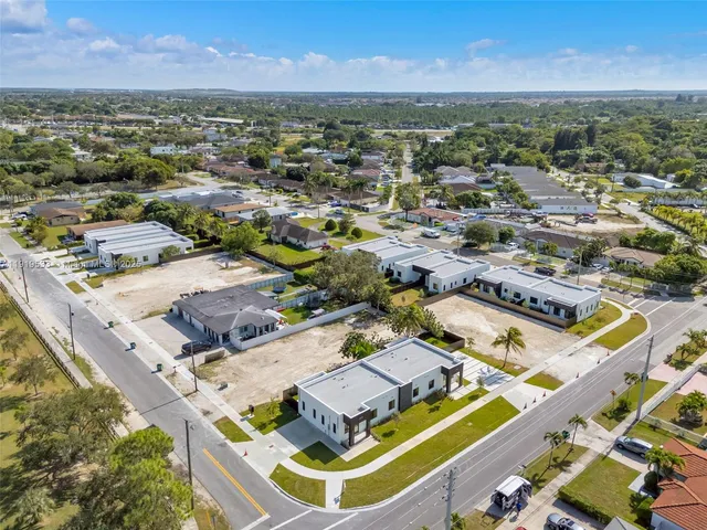 an aerial view of a house with a ocean view