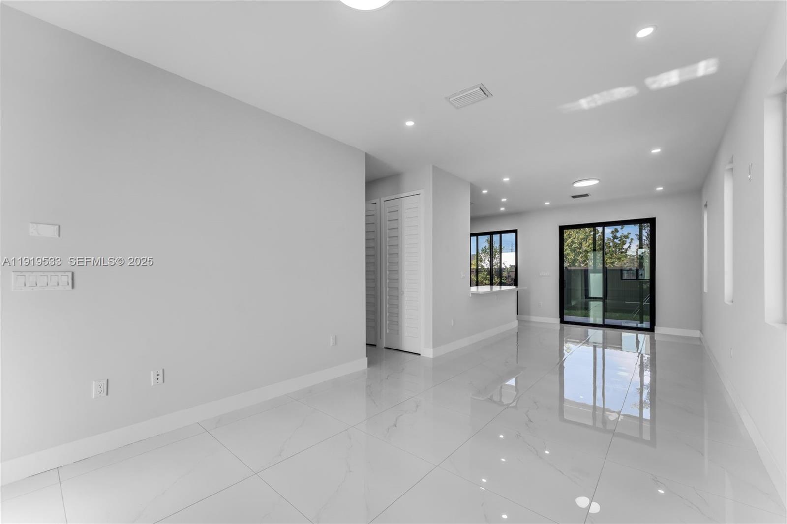 21911 Southwest 124th Avenue Miami, FL 33183 - Photo 5 of 24 an empty room with windows