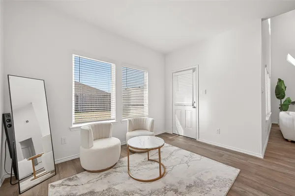 a living room with furniture and a window