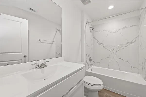 a bathroom with a sink toilet and a bathtub