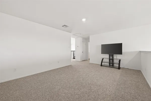 a view of a livingroom with a flat screen tv
