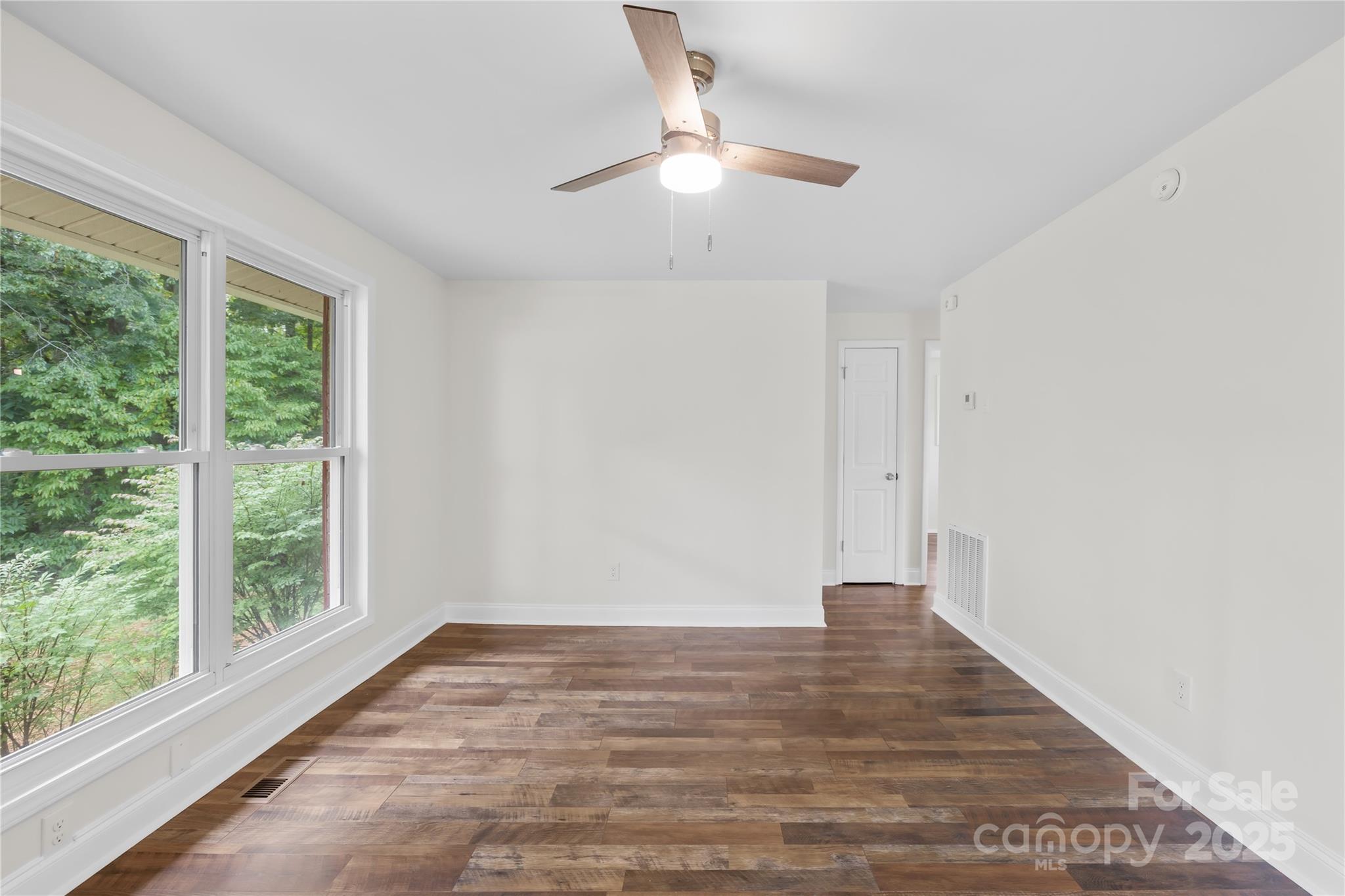 2333 Howells Ferry Road Hickory Grove, SC 29717 - Photo 17 of 30 a view of an empty room with wooden floor and a window