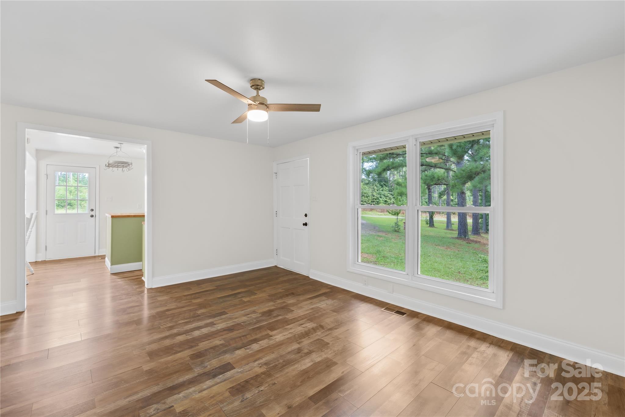 2333 Howells Ferry Road Hickory Grove, SC 29717 - Photo 18 of 30 a view of an empty room with wooden floor and a window