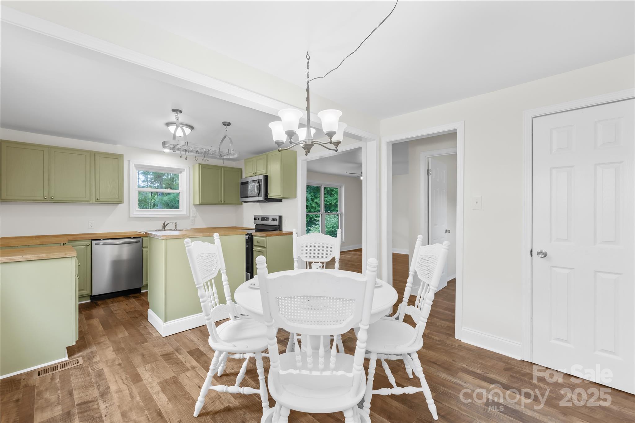 2333 Howells Ferry Road Hickory Grove, SC 29717 - Photo 20 of 30 a view of a dining room with furniture and wooden floor