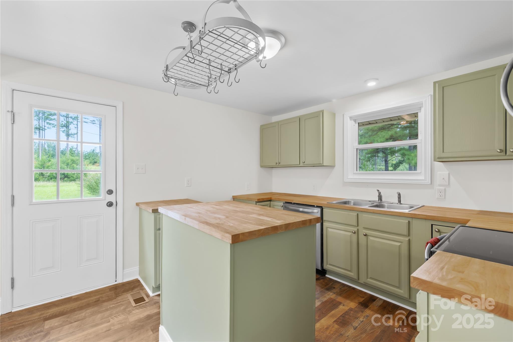 2333 Howells Ferry Road Hickory Grove, SC 29717 - Photo 22 of 30 a utility room with a sink a window and cabinets